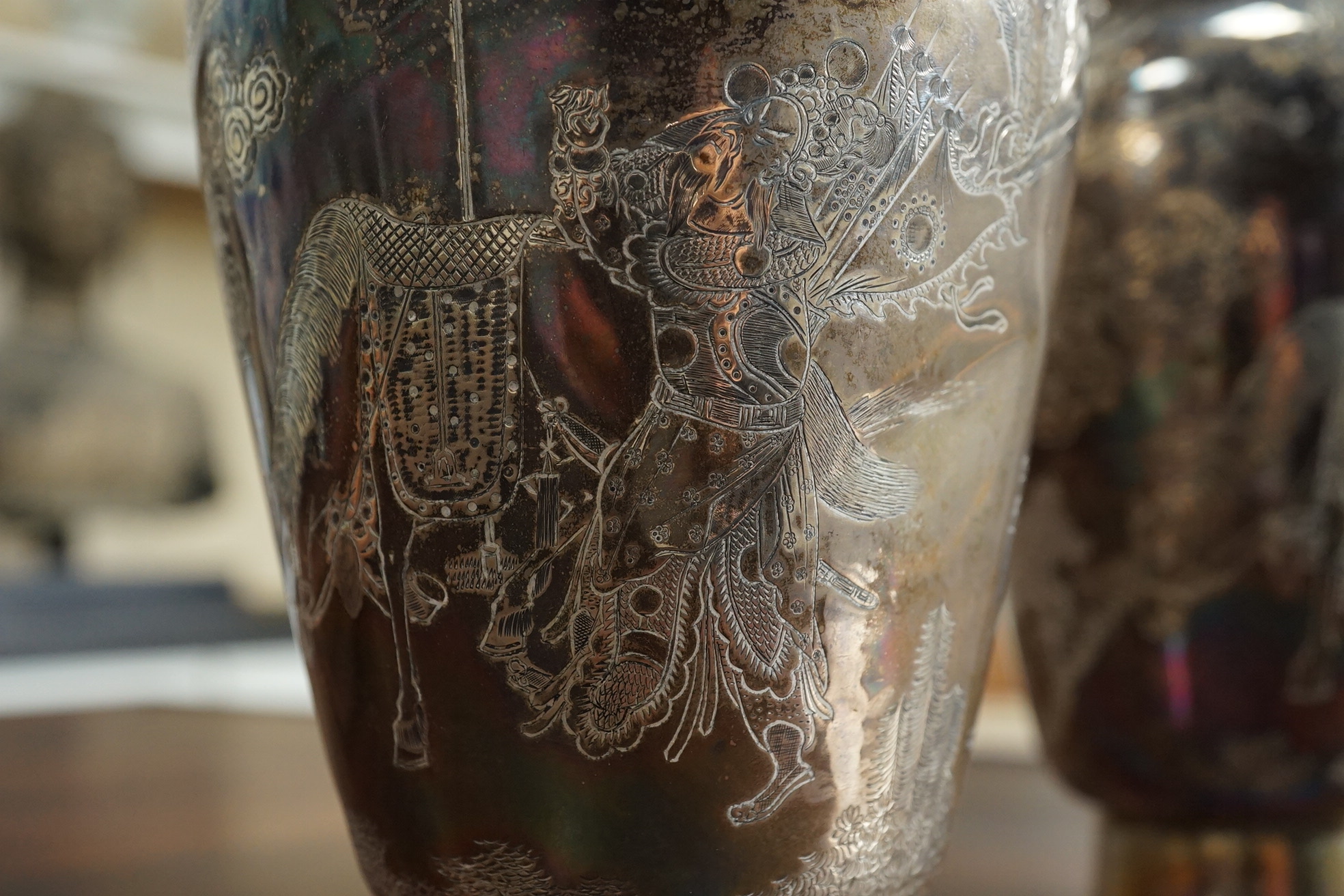 A pair of Chinese silver ‘immortals’ vases, late 19th century